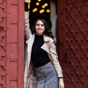 Women's grey plaid mini skirt with a high-waisted tailored fit, styled for a modern chic and sophisticated look.
